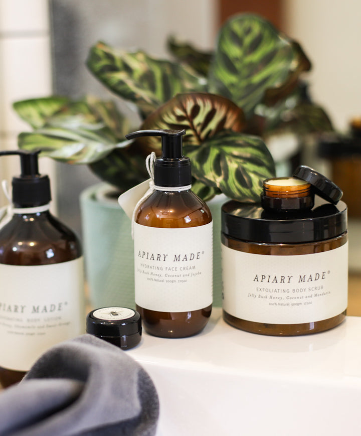 lotion and other products on bathroom sink